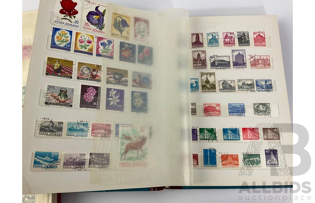 Four Albums of International Mint and Cancelled Stamps Including India, Germany, Rwanda, Australia, Cayman Islands, Magyar, USA, New Zealand, Fiji, Uruguay and More