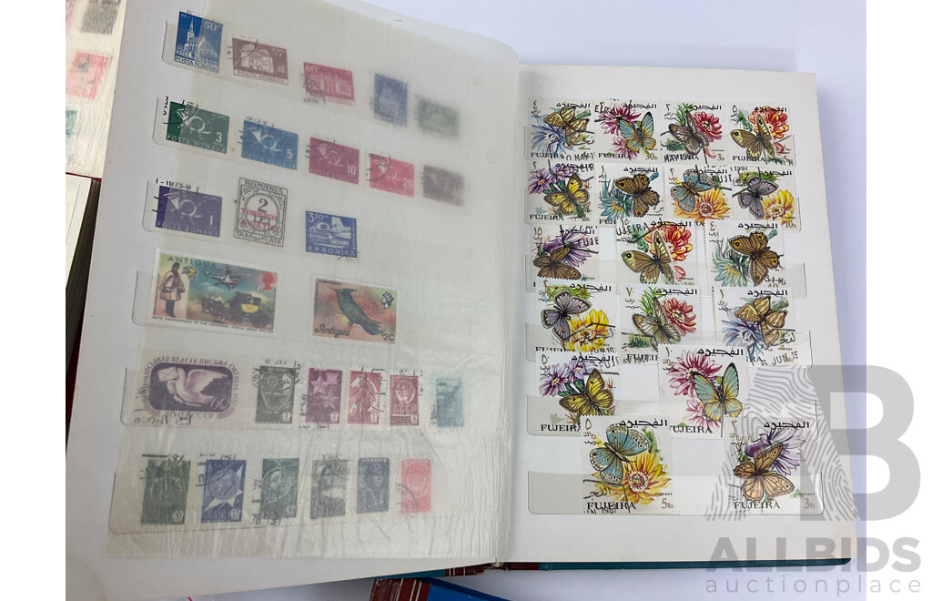 Four Albums of International Mint and Cancelled Stamps Including India, Germany, Rwanda, Australia, Cayman Islands, Magyar, USA, New Zealand, Fiji, Uruguay and More