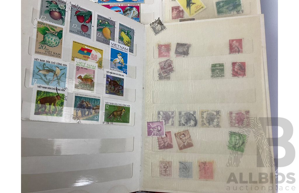 Four Albums of International Mint and Cancelled Stamps Including India, Germany, Rwanda, Australia, Cayman Islands, Magyar, USA, New Zealand, Fiji, Uruguay and More