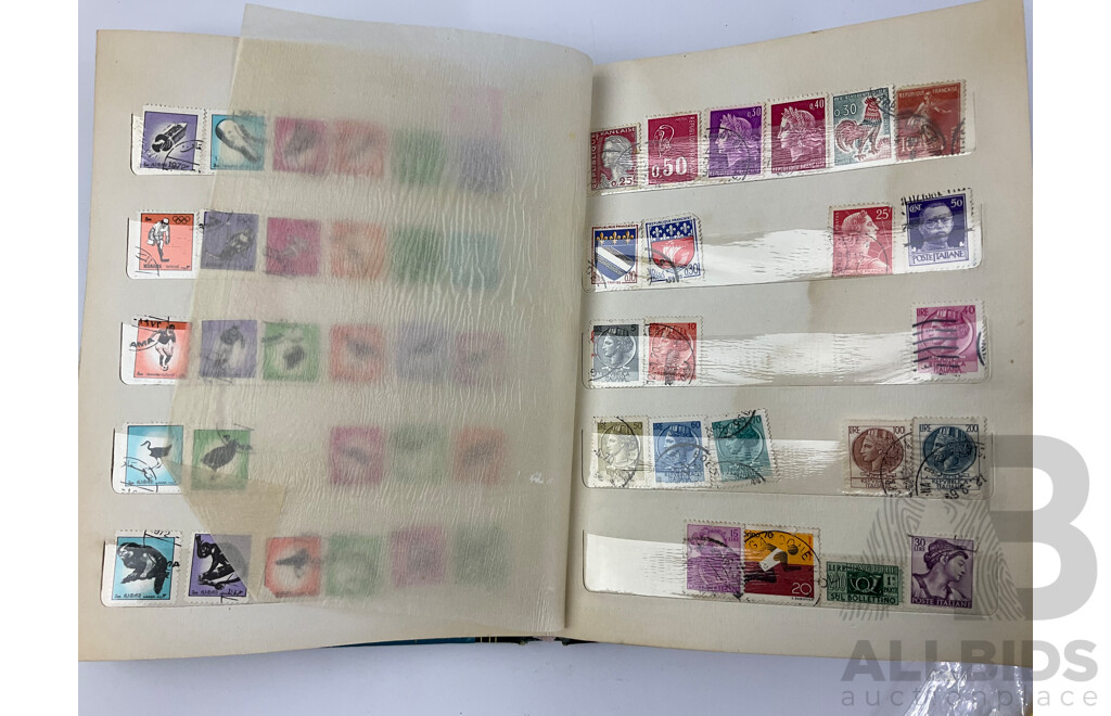 Four Albums of International Mint and Cancelled Stamps Including India, Germany, Rwanda, Australia, Cayman Islands, Magyar, USA, New Zealand, Fiji, Uruguay and More