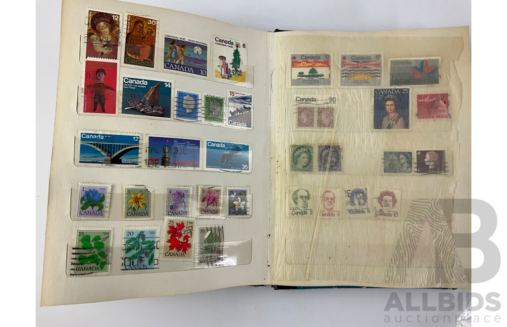 Four Albums of International Mint and Cancelled Stamps Including India, Germany, Rwanda, Australia, Cayman Islands, Magyar, USA, New Zealand, Fiji, Uruguay and More