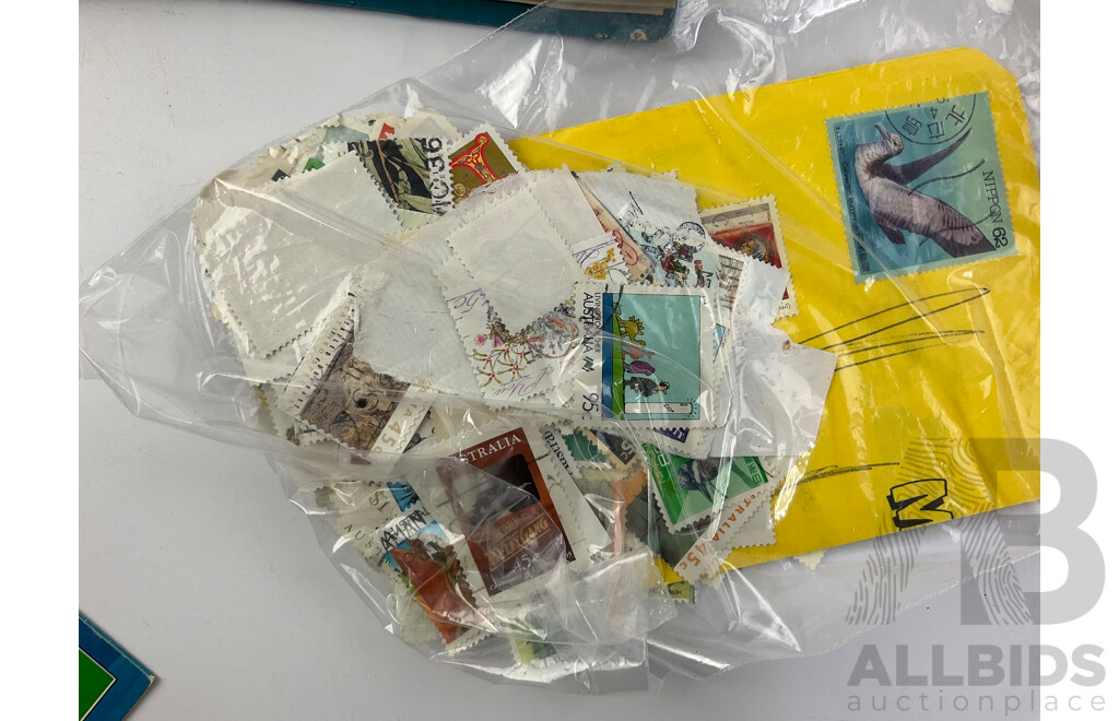 Four Albums of International Mint and Cancelled Stamps Including India, Germany, Rwanda, Australia, Cayman Islands, Magyar, USA, New Zealand, Fiji, Uruguay and More