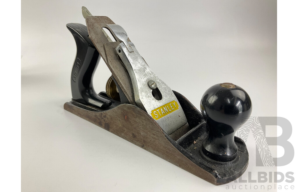 Three Vintage Stanley Bench Planes Including Number Four, Four and Half, Ten and Half, Twelve-one Hundred Universal