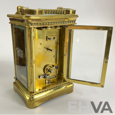 Antique Brass Traveling Clock, Ornate Floral Design with Beveled Glass and Case
