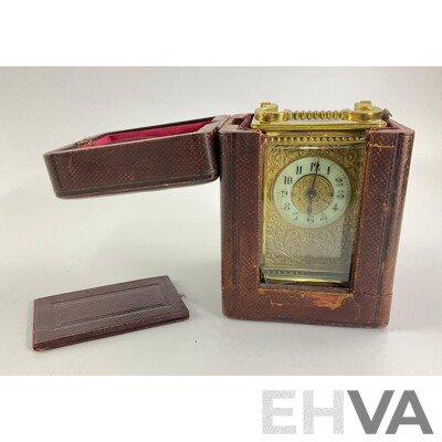 Antique Brass Traveling Clock, Ornate Floral Design with Beveled Glass and Case