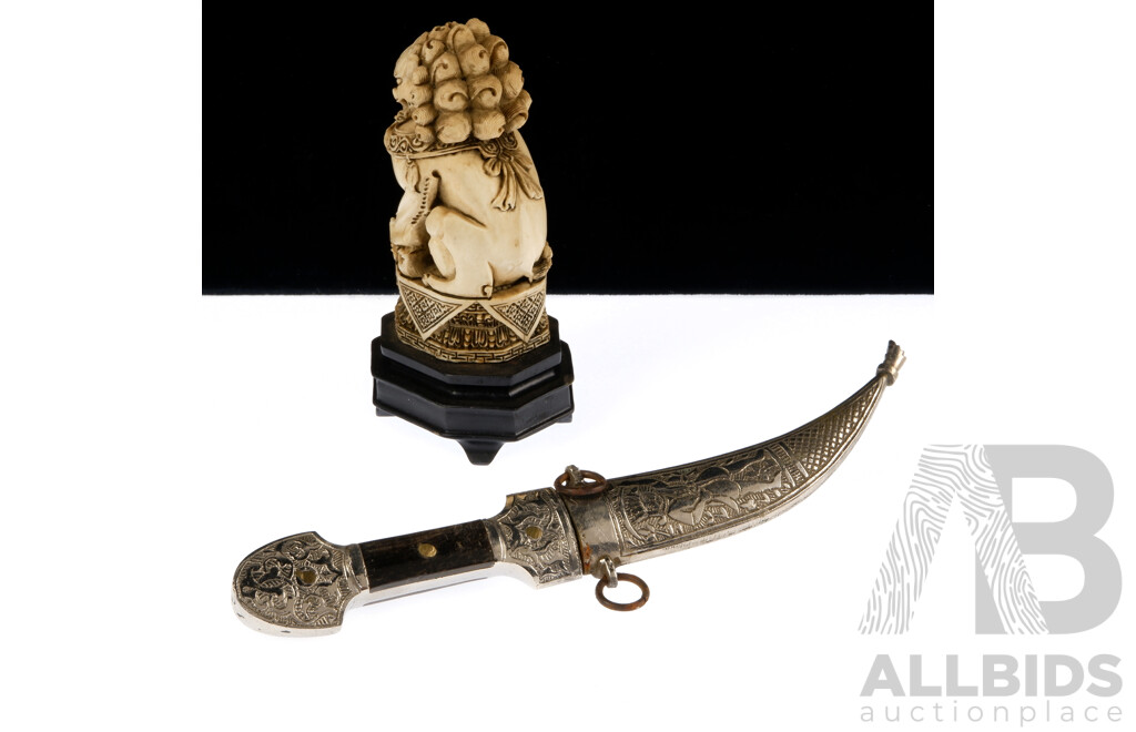 Vintage Arabic Jambiya Dagger with Engraved White Metal Sheath and Handle with Bone Detail Along with Composite Chinese Foo Dog Carving