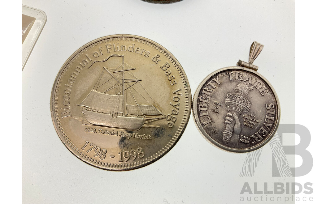 Collection of Collectible Coins Including Australian 1857 Hanks and Lloyd Tea Makers Token, 1998 Bicentennial of Flinders and Bass Voyage, 1808 East India Company Ship Wreck Coin, USA 1986 Trade Silver Pendant