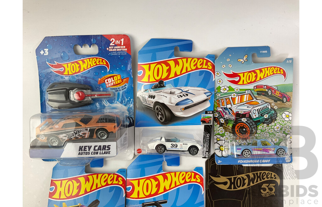 Collection of Boxed Diecast Hot Wheels Including Volkswagen Caddy, Airuption, Draggin Wagon, Dodge Challenger SRT with Construction Trucks and Teamsters