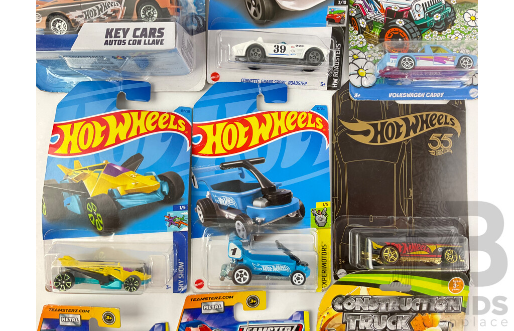 Collection of Boxed Diecast Hot Wheels Including Volkswagen Caddy, Airuption, Draggin Wagon, Dodge Challenger SRT with Construction Trucks and Teamsters