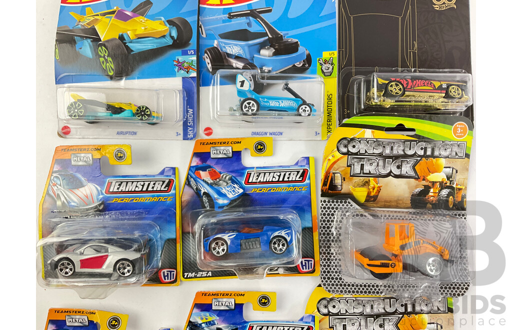 Collection of Boxed Diecast Hot Wheels Including Volkswagen Caddy, Airuption, Draggin Wagon, Dodge Challenger SRT with Construction Trucks and Teamsters