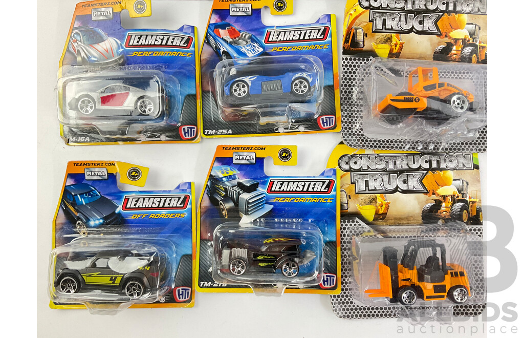 Collection of Boxed Diecast Hot Wheels Including Volkswagen Caddy, Airuption, Draggin Wagon, Dodge Challenger SRT with Construction Trucks and Teamsters