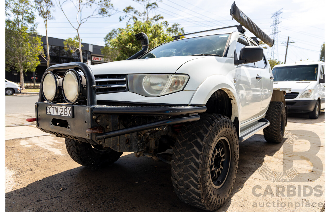 1/2014 Mitsubishi Triton GLX (4x4) MN MY15 Dual Cab Utility Solid White Turbo Diesel 2.5L