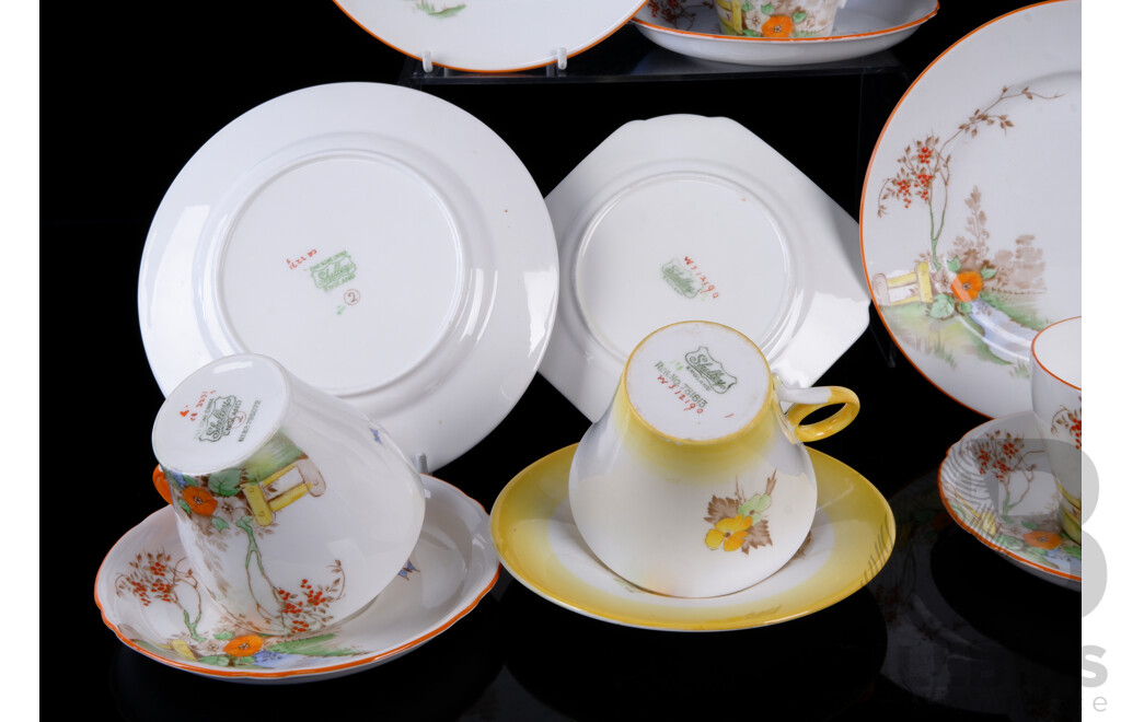 Four Vintage Shelly Porcelain Trios Comprising Three Oxford Shaped Country Scene Examples and One Phlox Yellow Example