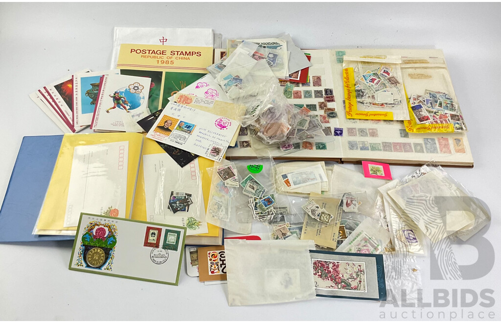 Collection of Vintage International Stamps Including Republic of China 1985 Album, First Day Covers and 1983 PNC, Isreal, Poland, Japan, Jamaica, New Zealand and More