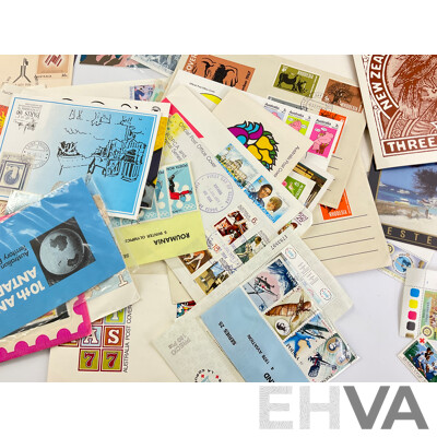 Collection of International Stamp Packs and First Day Covers Including Australia, New Zealand, Rhodesia, Poland and More