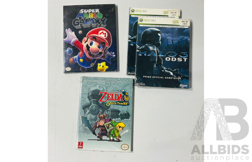 Collection of Video Game Guide Books for Legend of Zelda Spirit Tracks, Super Mario Galaxy and Halo 3 ODST