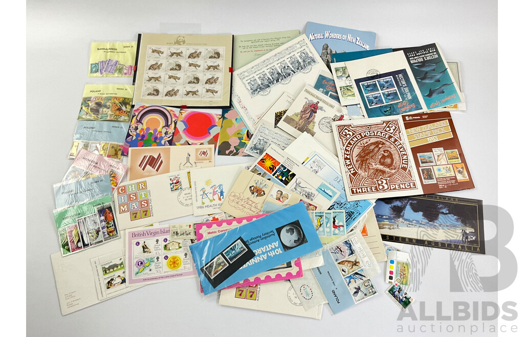 Collection of International Stamp Packs and First Day Covers Including Australia, New Zealand, Rhodesia, Poland and More