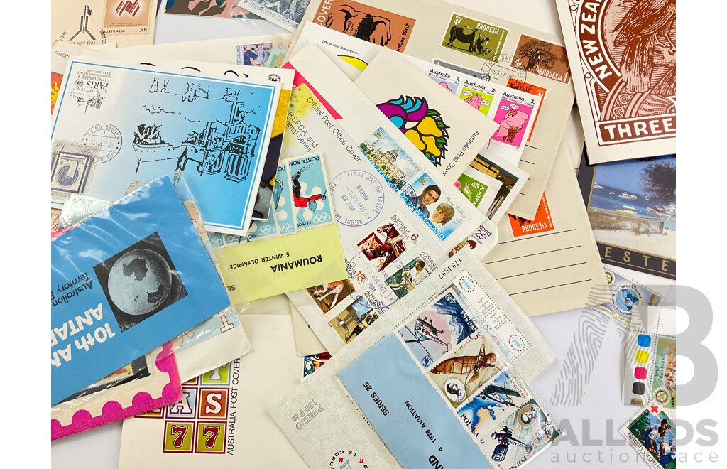 Collection of International Stamp Packs and First Day Covers Including Australia, New Zealand, Rhodesia, Poland and More