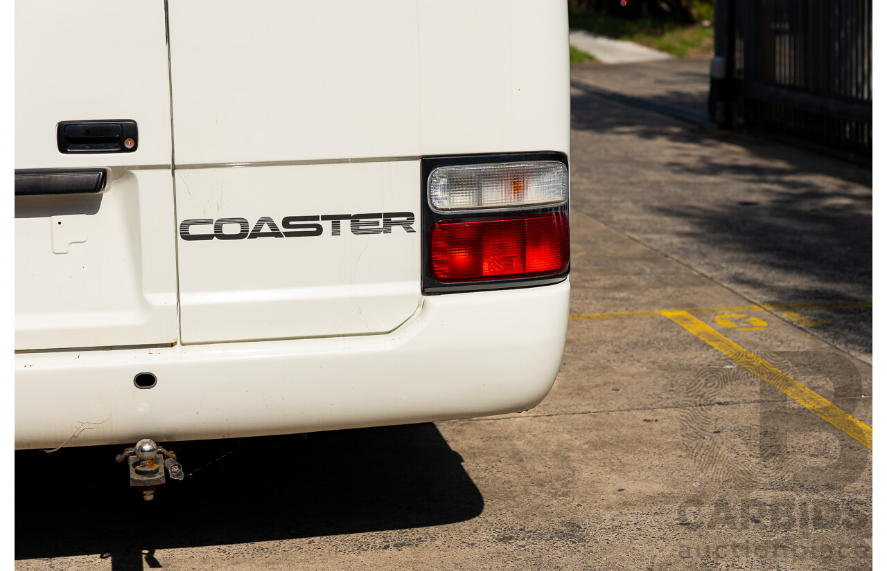 10/2012 Toyota Coaster LWB (4x2) XZB50R 07 Upgrade Bus White Turbo Diesel 4.0L - 21 Seater