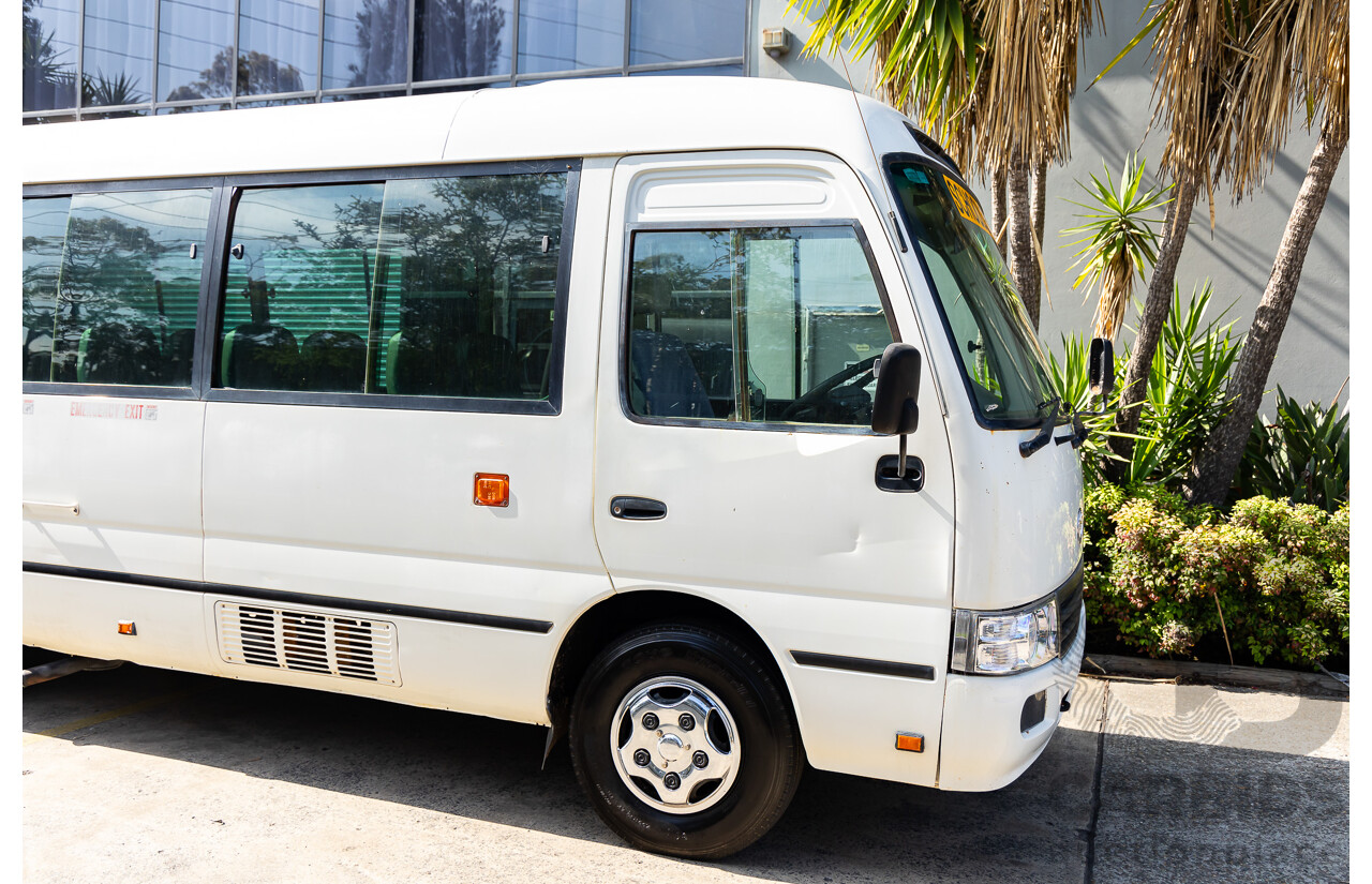 10/2012 Toyota Coaster LWB (4x2) XZB50R 07 Upgrade Bus White Turbo Diesel 4.0L - 21 Seater