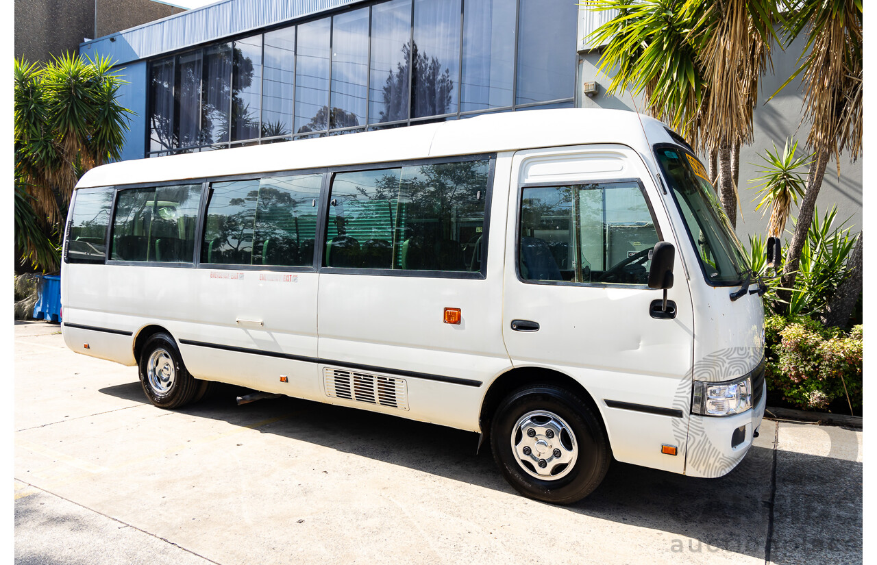 10/2012 Toyota Coaster LWB (4x2) XZB50R 07 Upgrade Bus White Turbo Diesel 4.0L - 21 Seater