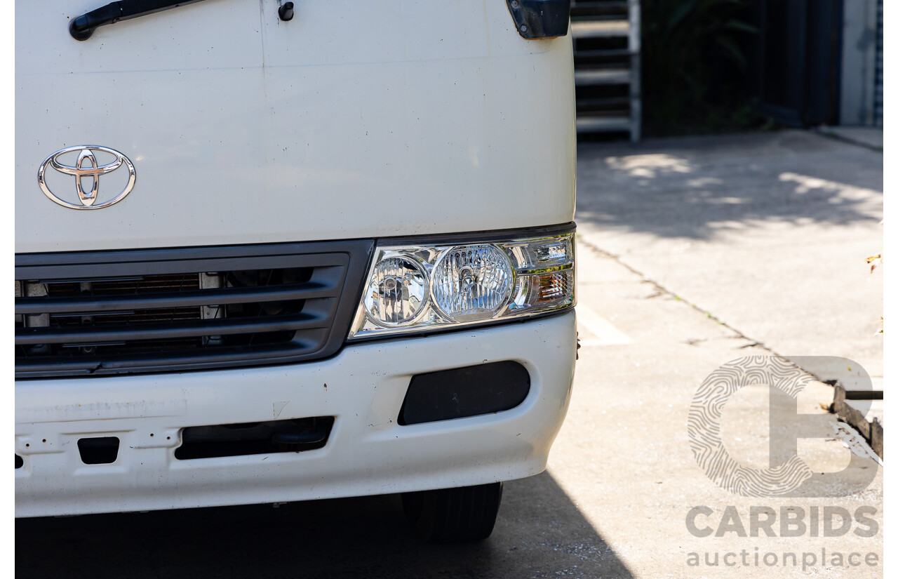 10/2012 Toyota Coaster LWB (4x2) XZB50R 07 Upgrade Bus White Turbo Diesel 4.0L - 21 Seater