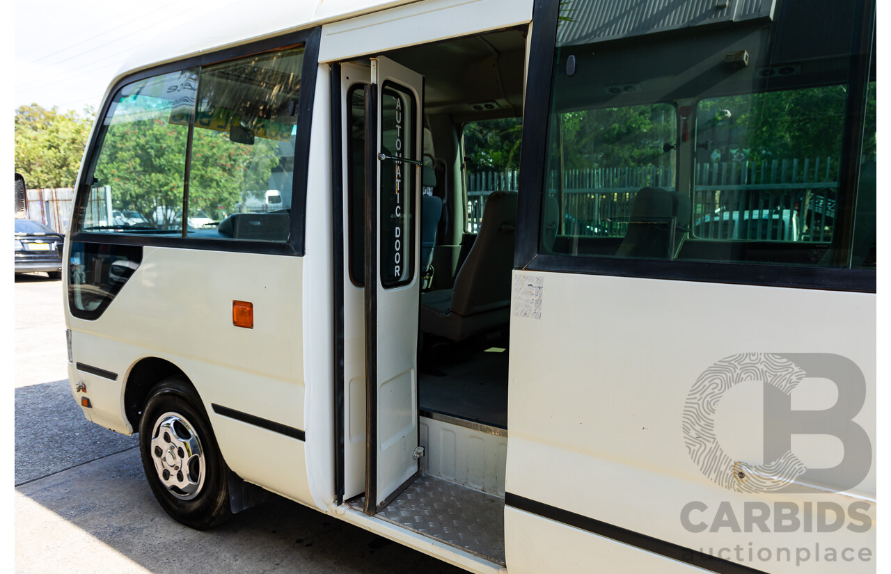 10/2012 Toyota Coaster LWB (4x2) XZB50R 07 Upgrade Bus White Turbo Diesel 4.0L - 21 Seater