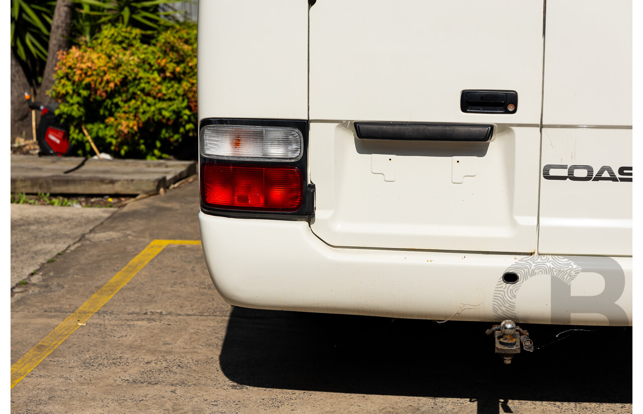 10/2012 Toyota Coaster LWB (4x2) XZB50R 07 Upgrade Bus White Turbo Diesel 4.0L - 21 Seater