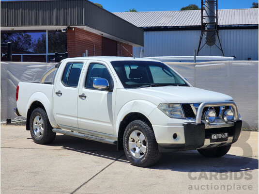 9/2009 Nissan Navara ST-X (4x4) D40 Dual Cab P/Up White 2.5L