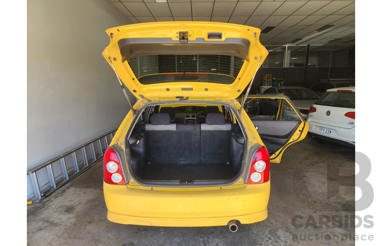 10/2002 Mazda 323 Astina SP20  5d Hatchback Yellow 2.0L