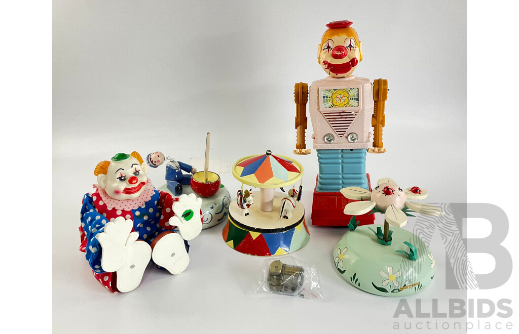 Collection of Vintage Toys Including Battery Powered Robot and Clown with Clock Work Carousel, Flower and Sailor