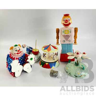 Collection of Vintage Toys Including Battery Powered Robot and Clown with Clock Work Carousel, Flower and Sailor