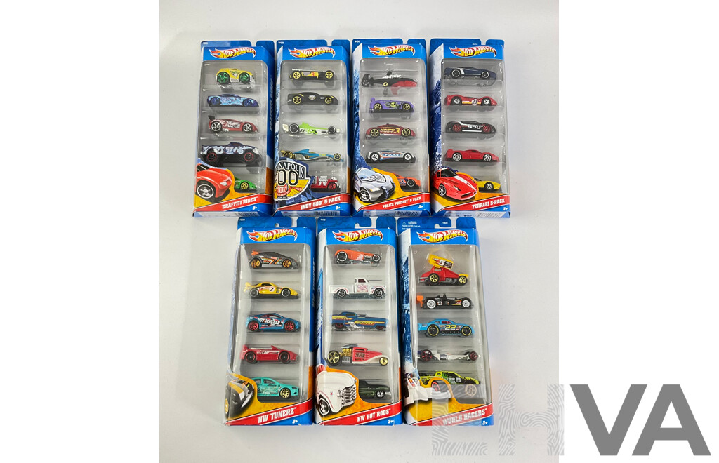 Seven Boxed Hot Wheels Five Packs Including Graffiti Riders, Indy 500, Police Pursuit, Ferrari, HW Tunerz, Hot Rods, World Racers