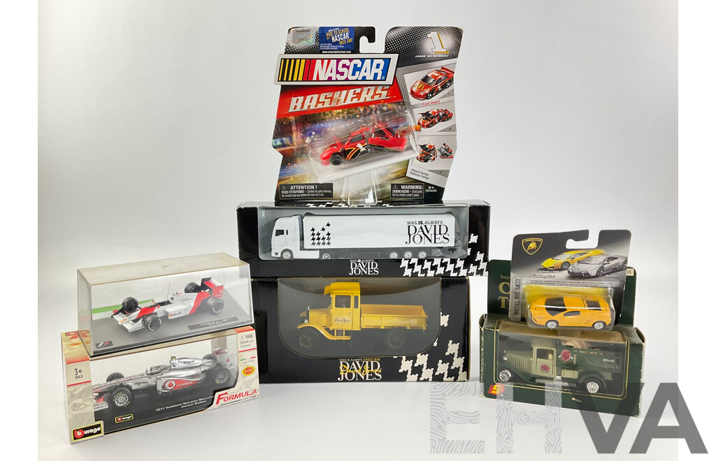 Assortment of Diecast Vehicles Including 1988 McLaren F! Ayrton Senna, Burago 2011 McLaren F1 Jenson Button, NASCAR Bashers, David Jones Trucks