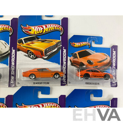 Ten Boxed Hot Wheels HW Showroom Vehicles Including Aston Martin DBS, 1968 Mercury Cyclone, 1964 Corvette Stingray