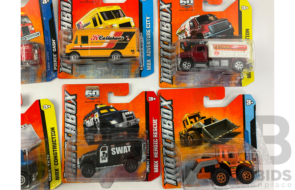 Collection of Twenty Boxed Diecast Matchbox Trucks, Vans and Tractors