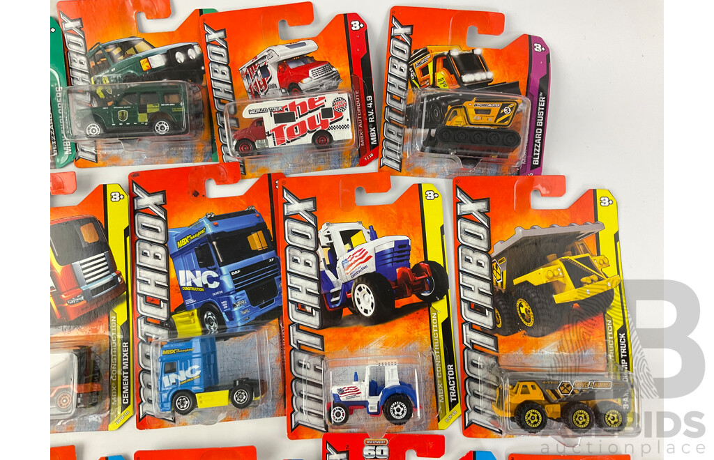 Collection of Twenty Boxed Diecast Matchbox Trucks, Vans and Tractors