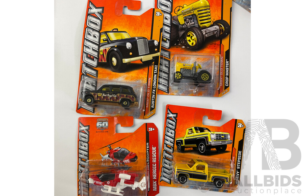 Collection of Twenty Boxed Diecast Matchbox Trucks, Tractors and Cars