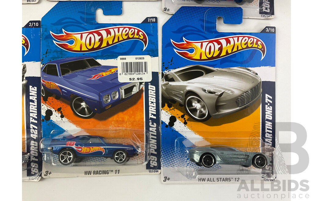 Twelve Boxed Hot Wheels Diecast Vehicles Including Muscle Mania and HW Performance 12