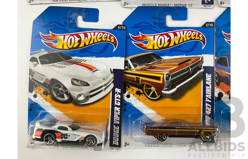 Twelve Boxed Hot Wheels Diecast Vehicles Including Muscle Mania and HW Performance 12