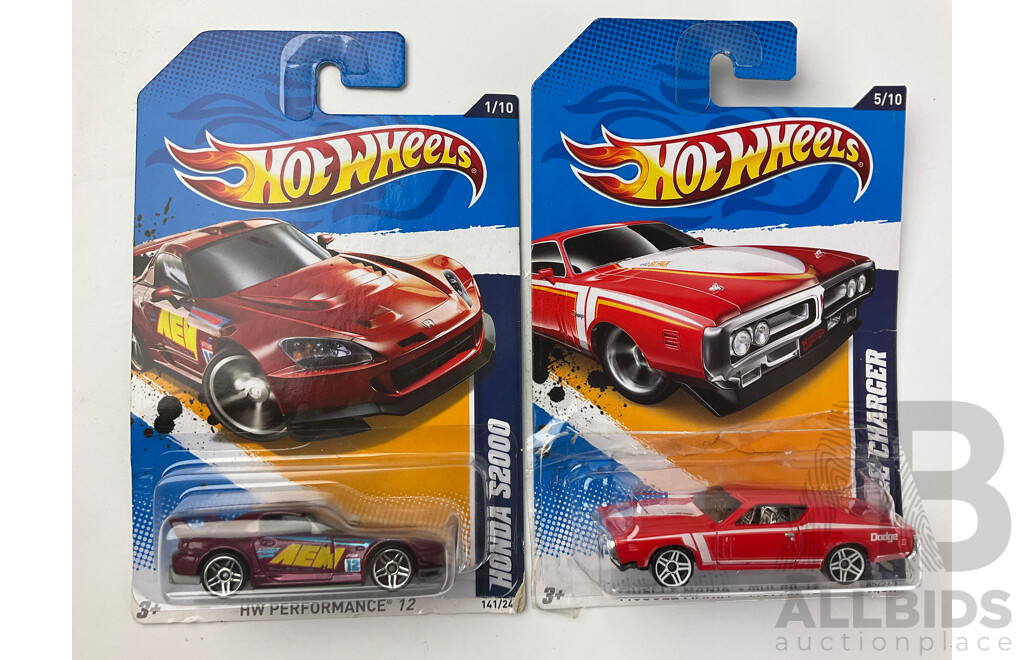 Twelve Boxed Hot Wheels Diecast Vehicles Including Muscle Mania and HW Performance 12