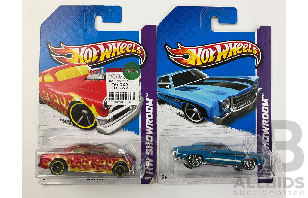 Twelve Boxed Hot Wheels HW Showroom Vehicles Including Shoe Box, 80's Corvette, 70 Hemi Cuda