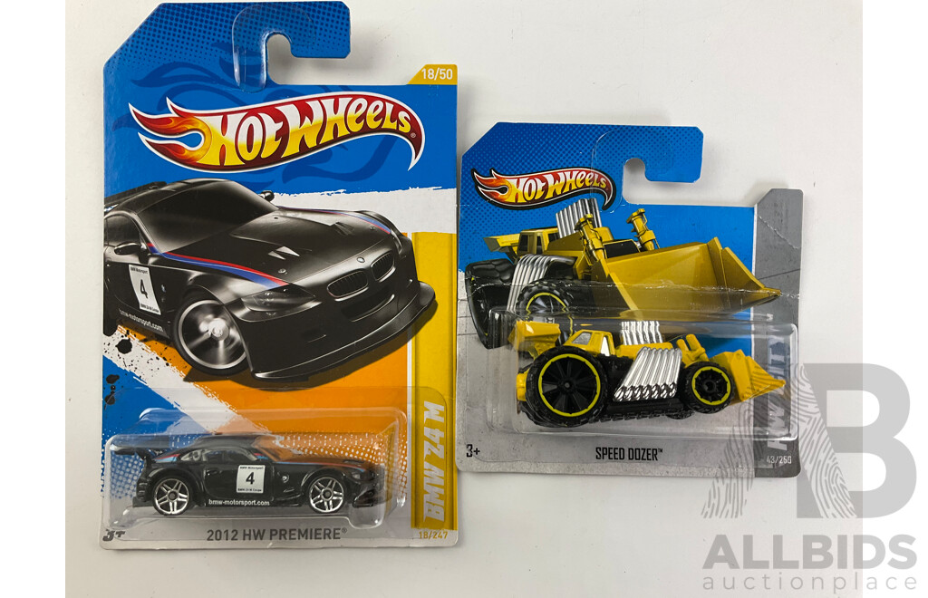 Twelve Boxed Hot Wheels Diecast Vehicles Including HW City, 'The Hot Ones' HW Imagination