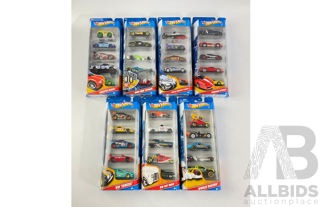 Seven Boxed Hot Wheels Five Packs Including Graffiti Riders, Indy 500, Police Pursuit, Ferrari, HW Tunerz, Hot Rods, World Racers