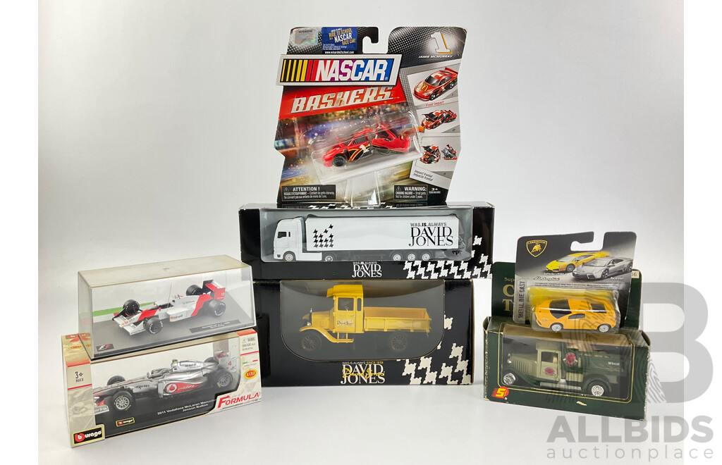 Assortment of Diecast Vehicles Including 1988 McLaren F! Ayrton Senna, Burago 2011 McLaren F1 Jenson Button, NASCAR Bashers, David Jones Trucks