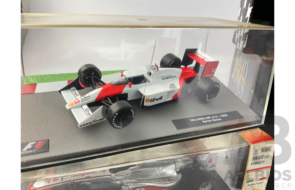 Assortment of Diecast Vehicles Including 1988 McLaren F! Ayrton Senna, Burago 2011 McLaren F1 Jenson Button, NASCAR Bashers, David Jones Trucks