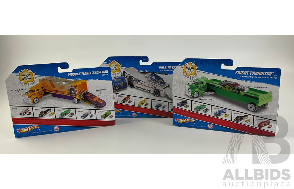 Three Boxed Hot Wheels Trucks Including Muscle Mania Show Car, Police Roll Patrol and Fright Freighter