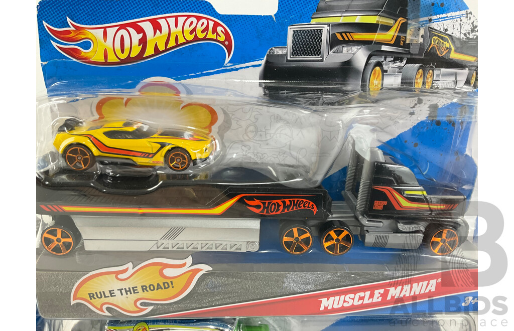 Four Boxed Hot Wheels Trucks Including Flatbed Farm Hauler, Stunt Car, Muscle Mania, UFO Squad