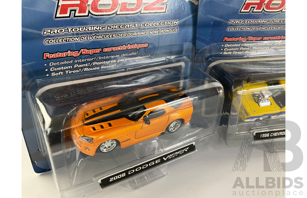 Four Boxed Diecast Maisto Pro Rodz Including 1986 Monte Carlo SS and 1971 Chevrolet Camaro Z/28 - 1:64 Scale