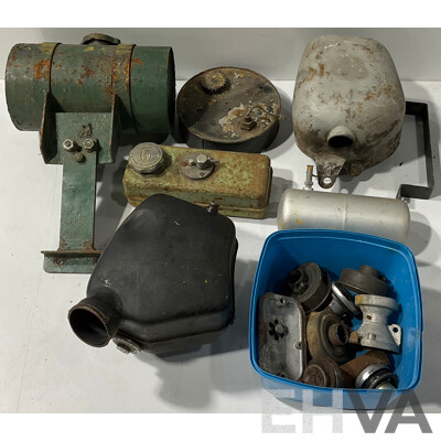 Collection of Vintage Lawn Mower Fuel Tanks and Other Accessories